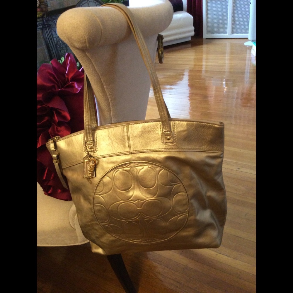 Gold Coach signature embossed large leather tote
